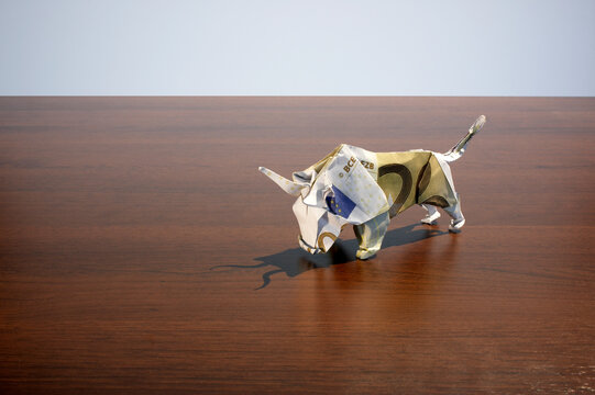 Origami euro banknote bull symbolizing financial growth