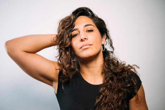 Young adult woman posing with confident expression