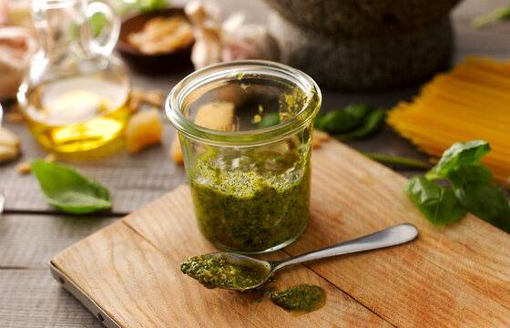 Preserving jar of homemade basil pesto