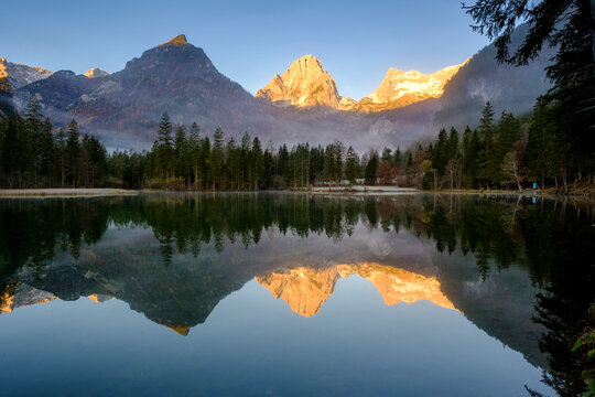 Schiederweiher lake at sunrise with Spitzmauer and Grosser Priel mountains in background