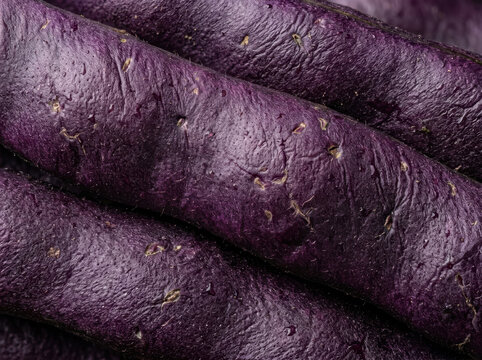 Purple string beans macro texture diagonal composition of fresh organic leguminous pods