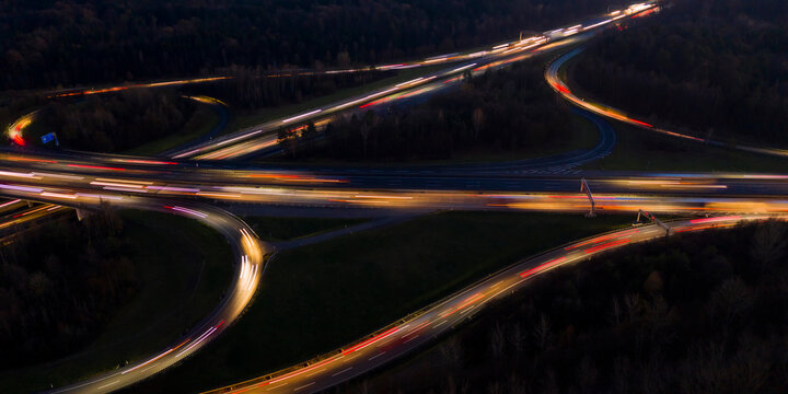 Germany, Baden-Wurttemberg, Stuttgart, Aerial view of vehicle light trails on Bundesautobahn 8 at night