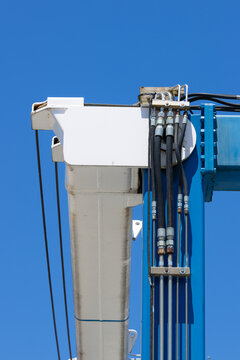 Hydraulic hoses and cables on industrial marine crane