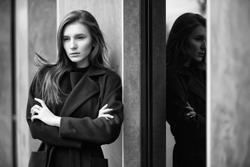 Fototapeta premium Girl in a coat black and white photo