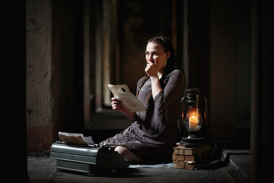 A girl with old books in the old house