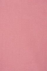 Fototapeta premium Pink textured fabric background with fine horizontal weave pattern