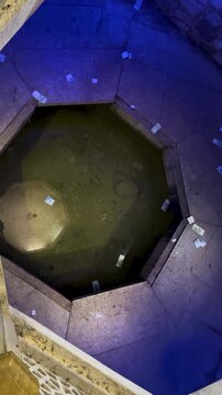Traditional architecture in Iran Persian pool indoor polygon water pond in Shiraz Saadi historic courtyard ornament the symmetric geometry interior design tilework reflection fountain Islamic culture