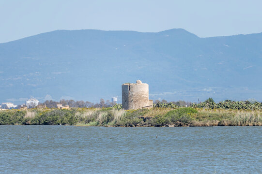 Su Pottu historical Spanish tower on lagoon shore, Cabras, Italy