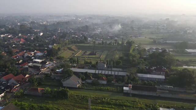 An aerial view of Sambisari Temple on a foggy morning. This Shivaist Hindu temple was built in the 9th century during the ancient Mataram Kingdom. The temple courtyard is 6.5 meters below ground level