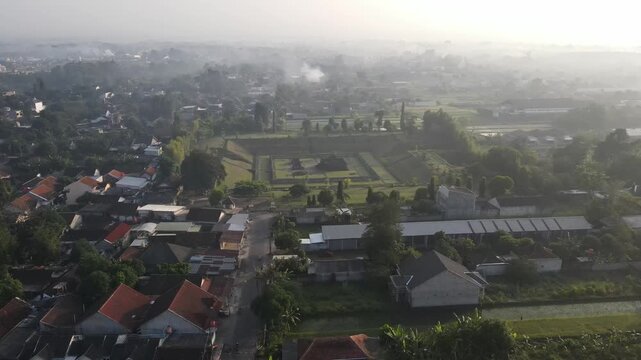 An aerial view of Sambisari Temple on a foggy morning. This Shivaist Hindu temple was built in the 9th century during the ancient Mataram Kingdom. The temple courtyard is 6.5 meters below ground level
