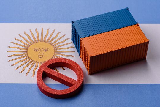The cargo container ban on the Argentina flag as a conceptual backdrop. The cargo container embargo