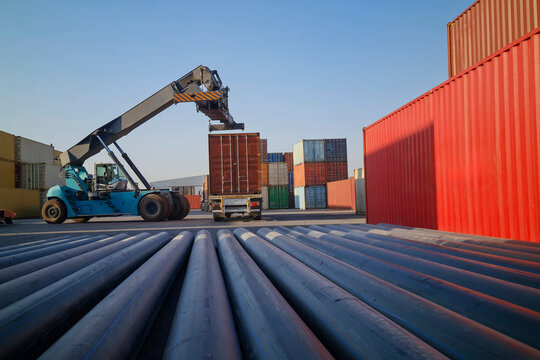 Reach stacker crane handling containers at a cargo port