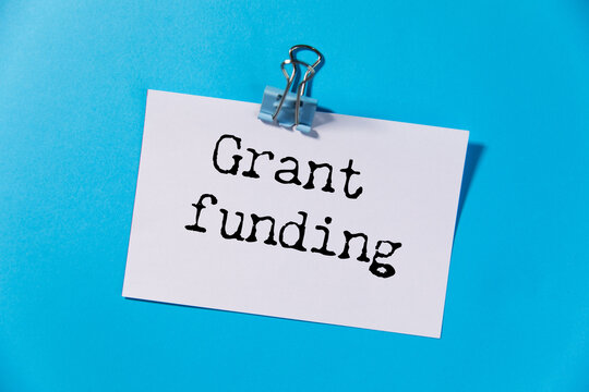 Grant funding symbol. text on a page