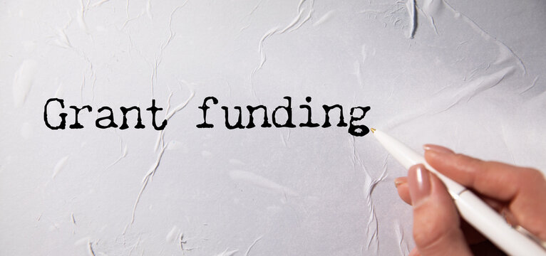 Grant funding symbol. text on a page