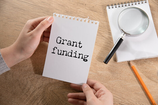Grant funding symbol. text on a page