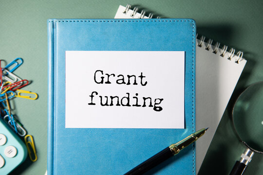Grant funding symbol. text on a page