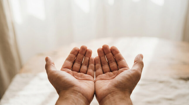 Open empty hands held out in a gesture of receiving or offering