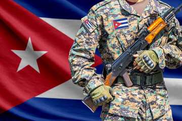Fototapeta premium Cuba flag with soldier holding assault rifle