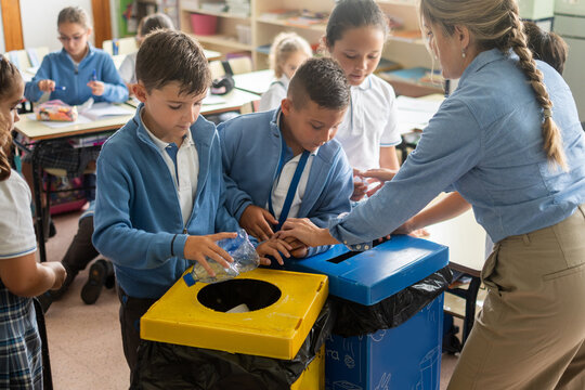 Elementary School Students Learning to Recycle Plastic Bottles