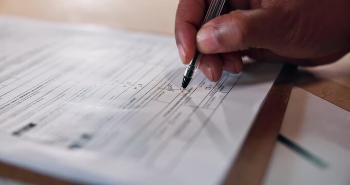Person, hands and signature with application for real estate contract, mortgage loan or settlement. Closeup, signing or home owner filling form with pen for legal agreement or property deal on desk
