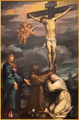 Fototapeten Jesus Christus LUCCA, ITALY - JUNE 23, 2026: The painting of Cricifixion with the Virgin Mary, St. Francis of Assisi and St. Catherine in the church Chiesa dei Santi Giovanni e Reparata by Francesco Vanni (1609)  © Renáta Sedmáková