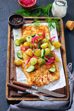 Baked salmon fillet, new potatoes, pickled onion