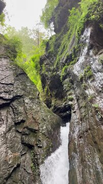 Crystal Clear Waterfall Flowing Through a Rocky Mountain Gorge in Abbottabad, Khyber Pakhtunkhwa, Pakistan | Vertical Video