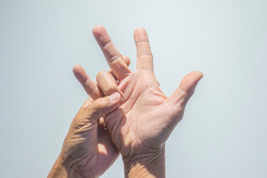 Hands of senior people on white background. Health care concept.