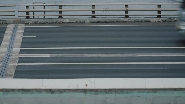 Fast moving cars with motion blur on city highway.
