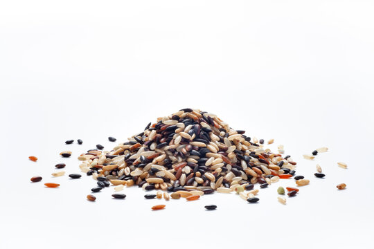 pile of seven different organic rice grains on white backgroiund, Healthy food concept