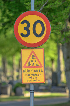Swedish thirty speed limit sign with careful driving message.