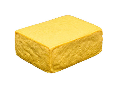 A rectangular block of firm yellow tofu, showcasing its fine textured surface, isolated on a transparent background.