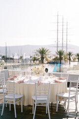 Obraz premium Elegant outdoor wedding dinner at Porto Montenegro Yacht Club