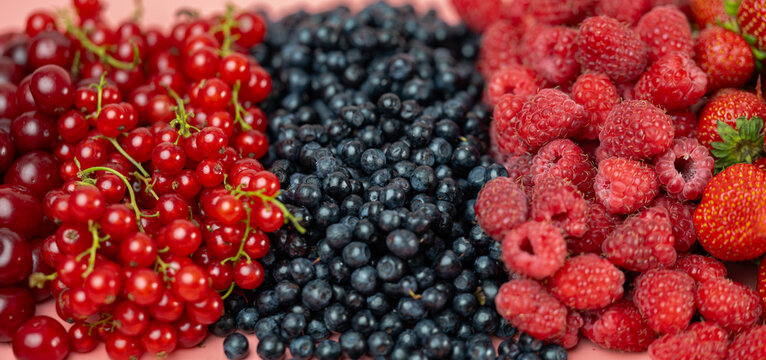 Mix of different ripe tasty berries as background