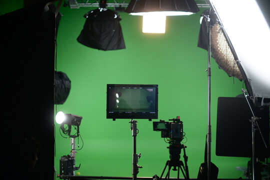 Film set, monitors and modern shooting equipment. Film crew, lighting devices, monitors, playbacks - filming equipment and a team of specialists in filming movies, advertising and TV series