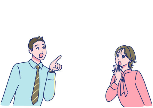 斜め上を見てビックリする男女の会社員