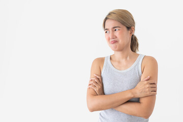 Fototapeta premium Displeased young Asian Thai woman with a disgusted expression and crossed arms looking away.