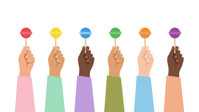 Diverse hands holding colorful balls up in the air together in unity