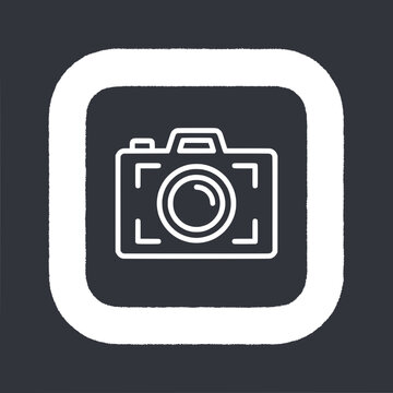 Simple line art icon of a camera inside a rounded square frame, white on dark background
