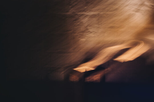 Copper & Cadence &mdash; Cinematic abstract of a cozy late-night recording studio workspace, featuring warm ambient light dragging across raw jute textures, instrument geometry, and fluid intentional camera
