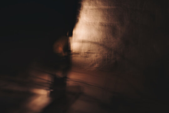 Copper & Cadence &mdash; Cinematic abstract of a cozy late-night recording studio workspace, featuring warm ambient light dragging across raw jute textures, instrument geometry, and fluid intentional camera