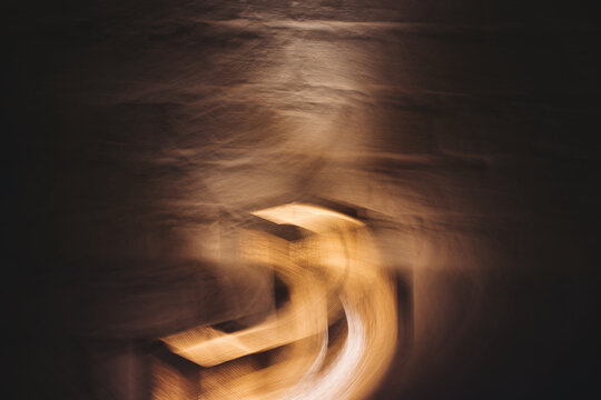 Copper & Cadence &mdash; Cinematic abstract of a cozy late-night recording studio workspace, featuring warm ambient light dragging across raw jute textures, instrument geometry, and fluid intentional camera