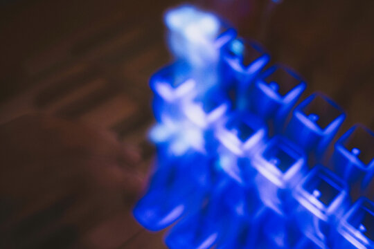 Copper & Cadence &mdash; Cinematic abstract of a cozy late-night recording studio workspace, featuring warm ambient light dragging across raw jute textures, instrument geometry, and fluid intentional camera
