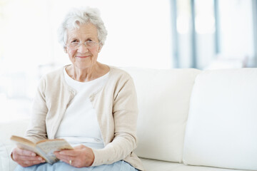 Obraz premium Relax, portrait or old woman in home with book, fantasy reading or insight in literature hobby. Space, glasses or senior person on sofa with fairytale, peaceful moment or fiction story in retirement.