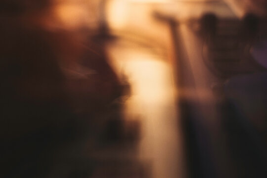 Copper & Cadence &mdash; Cinematic abstract of a cozy late-night recording studio workspace, featuring warm ambient light dragging across raw jute textures, instrument geometry, and fluid intentional camera