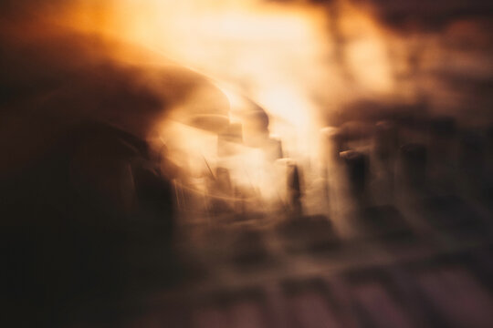 Copper & Cadence &mdash; Cinematic abstract of a cozy late-night recording studio workspace, featuring warm ambient light dragging across raw jute textures, instrument geometry, and fluid intentional camera