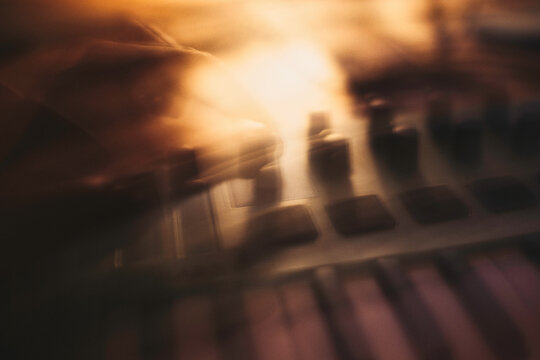 Copper & Cadence &mdash; Cinematic abstract of a cozy late-night recording studio workspace, featuring warm ambient light dragging across raw jute textures, instrument geometry, and fluid intentional camera