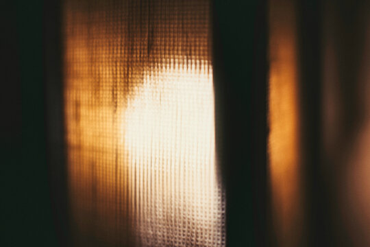Copper & Cadence &mdash; Cinematic abstract of a cozy late-night recording studio workspace, featuring warm ambient light dragging across raw jute textures, instrument geometry, and fluid intentional camera