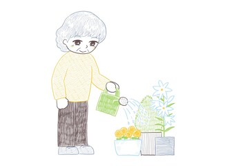 植木鉢の植物にじょうろで水やりをするシニアの女性 © 副島　紀子