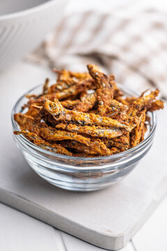Crispy Fried smelts in Glass Bowl, Crunchy Seafood Snack and Savory Appetizer Close-Up